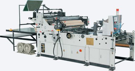 Industrial automatic window patching machine used for applying transparent film patches to die-cut folding cartons.